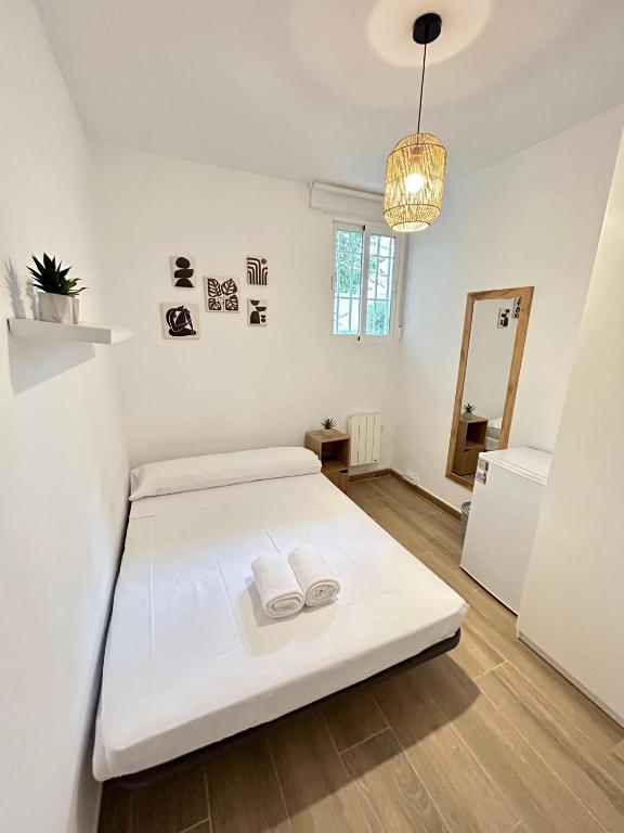 Ένα ή περισσότερα κρεβάτια σε δωμάτιο στο Rooms Sincelejo