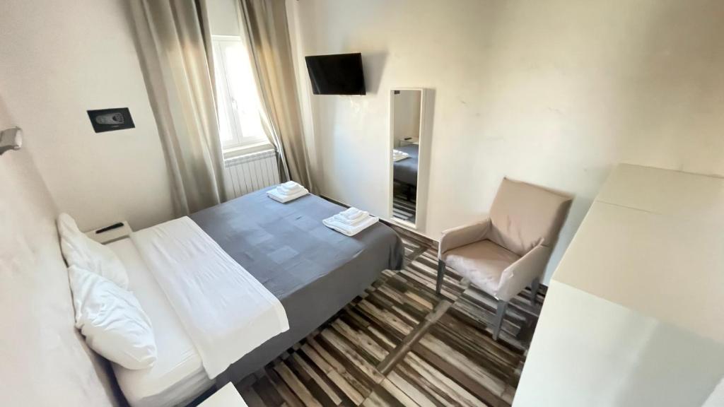 Postel nebo postele na pokoji v ubytování Bed and Breakfast Mezzanotte