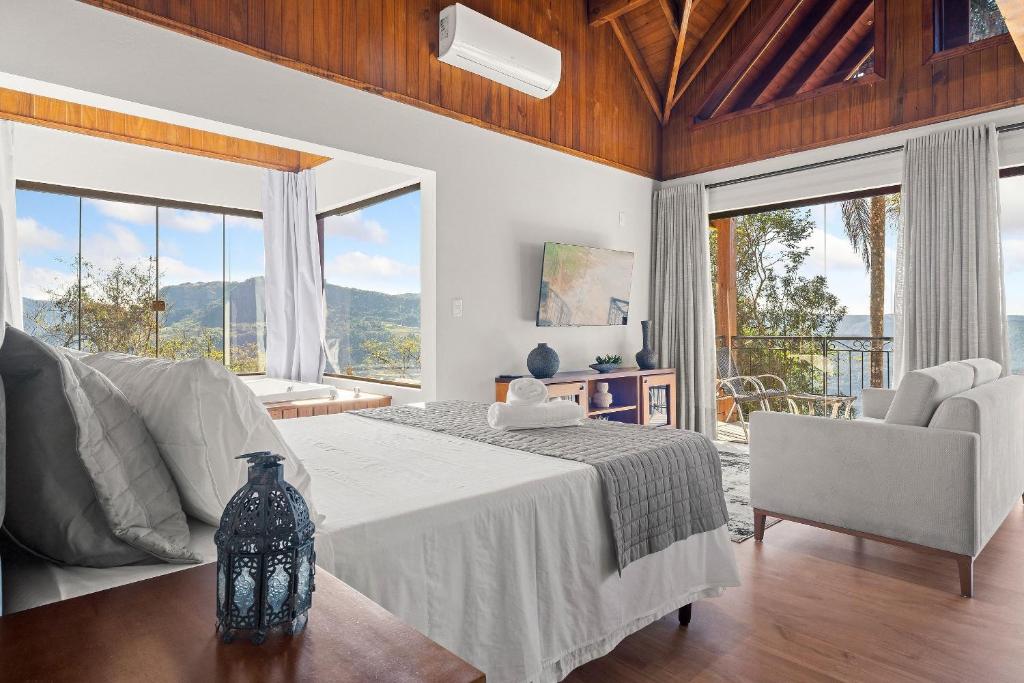 Postel nebo postele na pokoji v ubytování Cabana Lila Hütte Vila Germânica by Achei