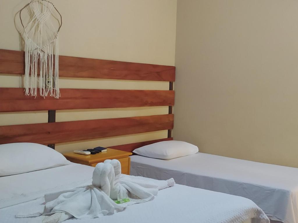 Postel nebo postele na pokoji v ubytování POUSADA FLORA