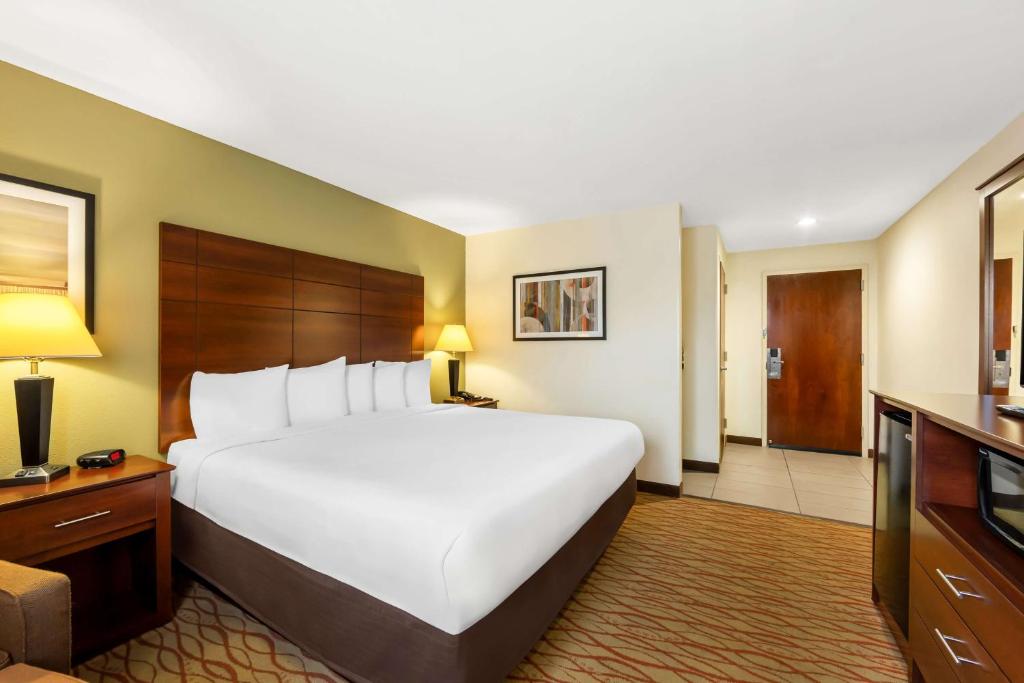 a large white bed in a hotel room at Best Western Dayton in Dayton