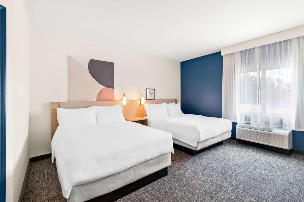 Postel nebo postele na pokoji v ubytování Spark By Hilton Longview