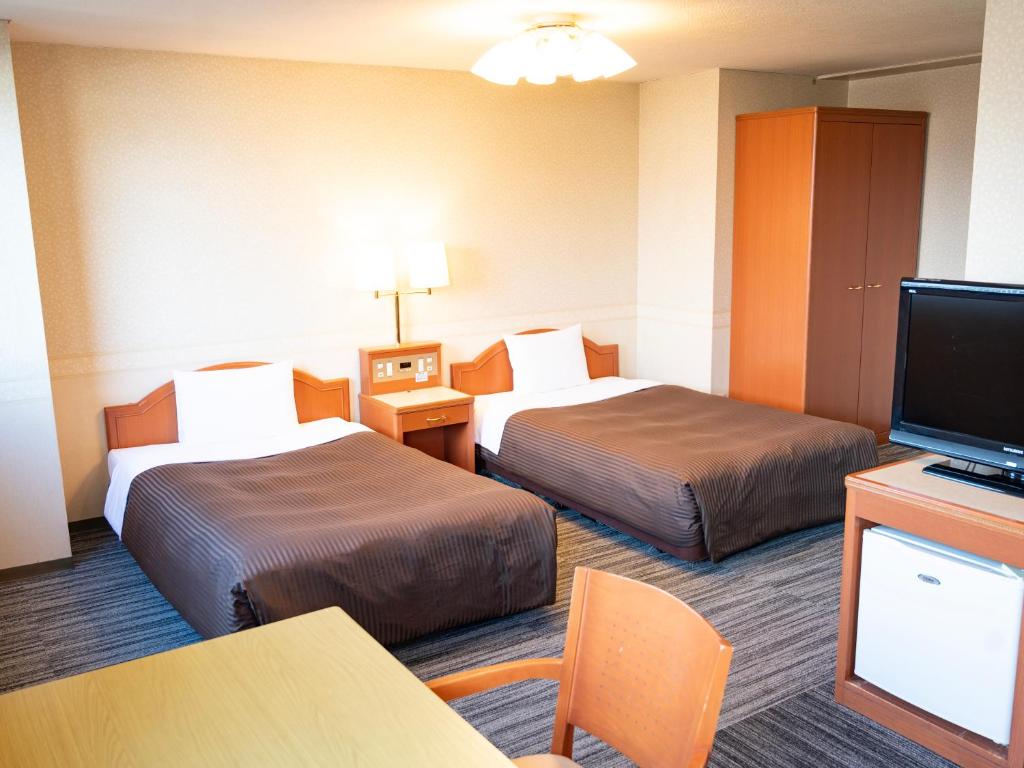 TV a/nebo společenská místnost v ubytování Numazu Grand Hotel