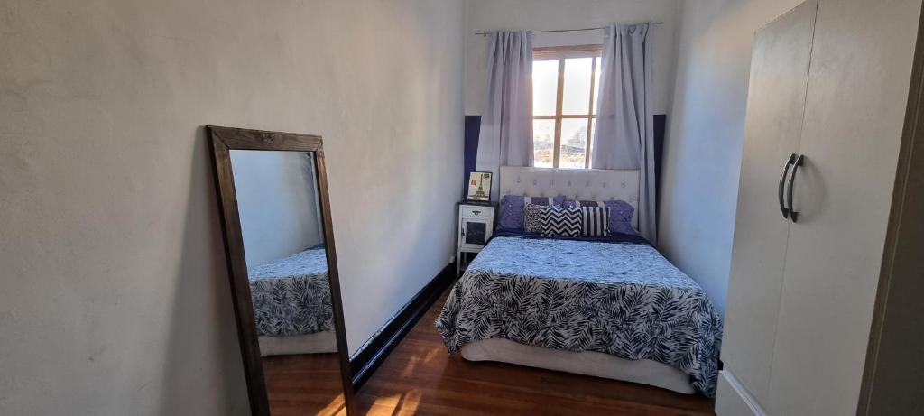 Postel nebo postele na pokoji v ubytování Windmill Hostel