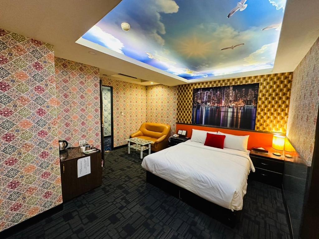 Postel nebo postele na pokoji v ubytování Wecity Hotel 薇城精緻旅店