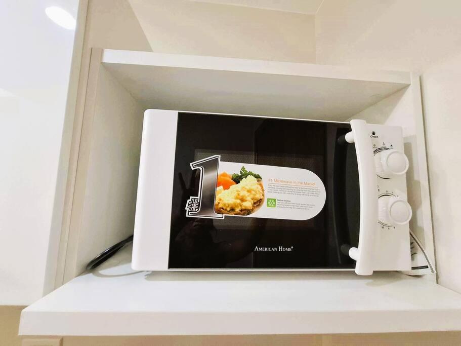 a box with a picture of a plate of food at Comfy Condo Near NAIA Airport in Manila