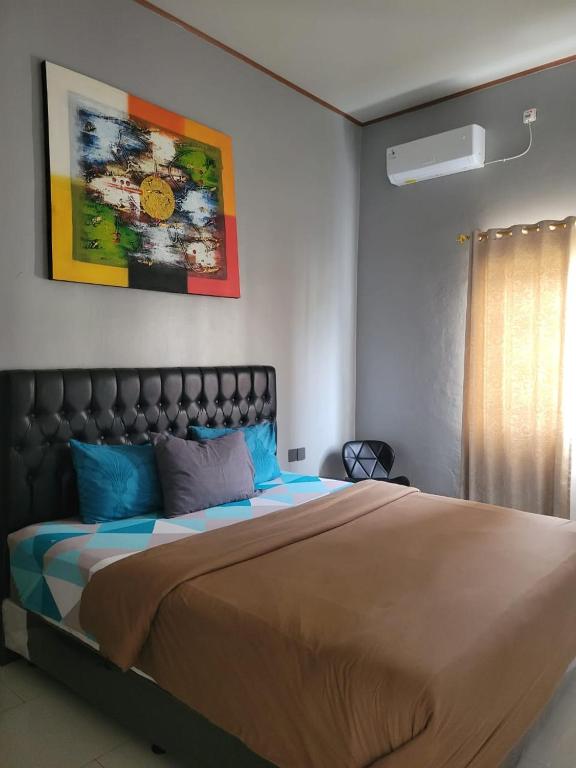 Postel nebo postele na pokoji v ubytování 9 Residences Seminyak
