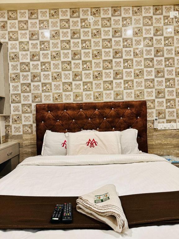 Postel nebo postele na pokoji v ubytování MARINA PALACE