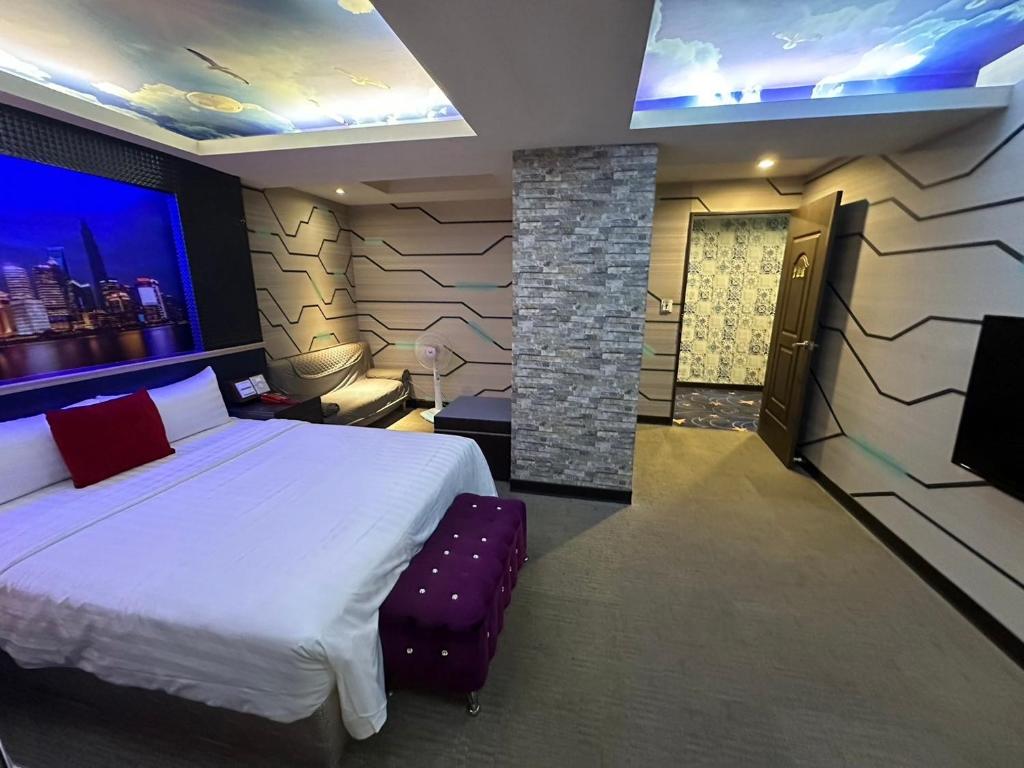 Postel nebo postele na pokoji v ubytování Wecity Hotel 薇城精緻旅店