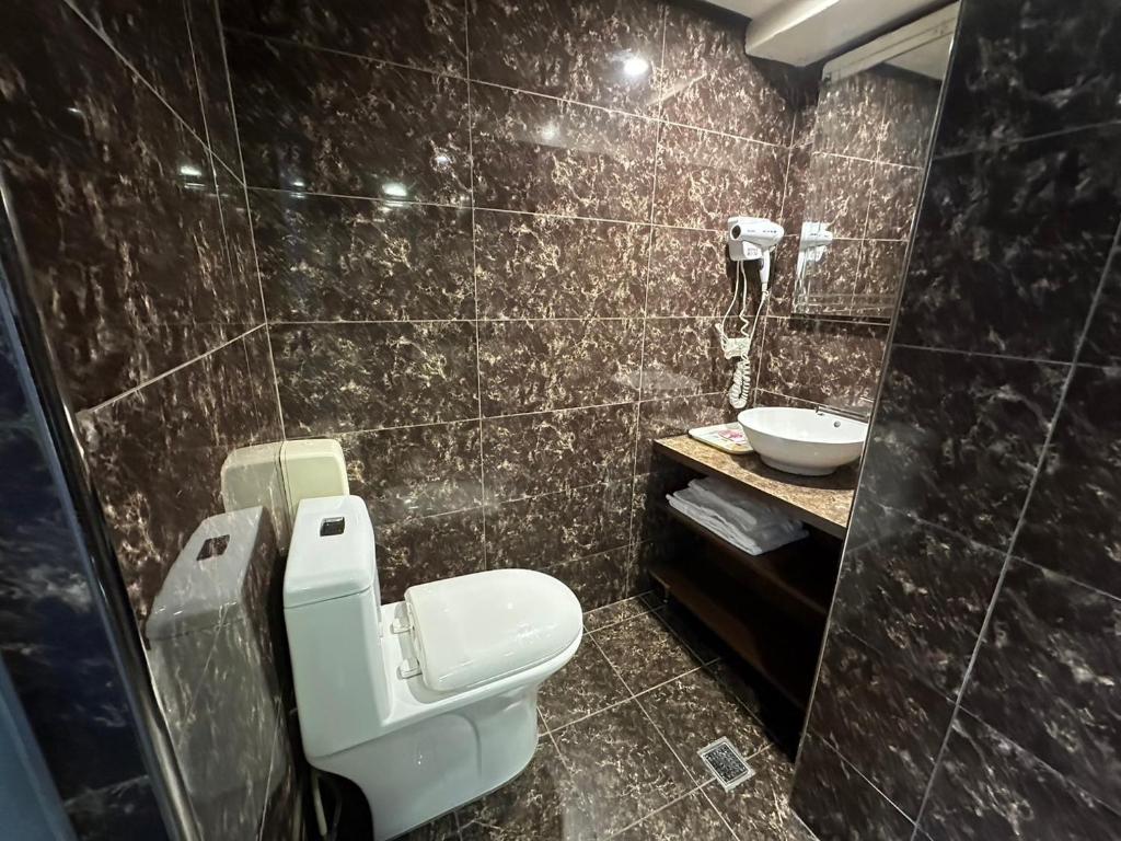Koupelna v ubytování Wecity Hotel 薇城精緻旅店