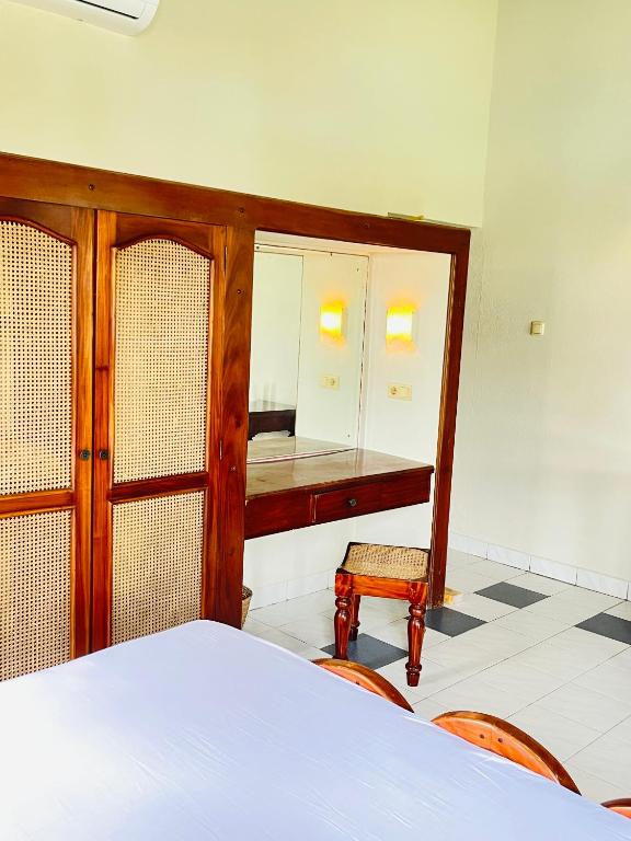 Postel nebo postele na pokoji v ubytování Crystal Villa Weligama
