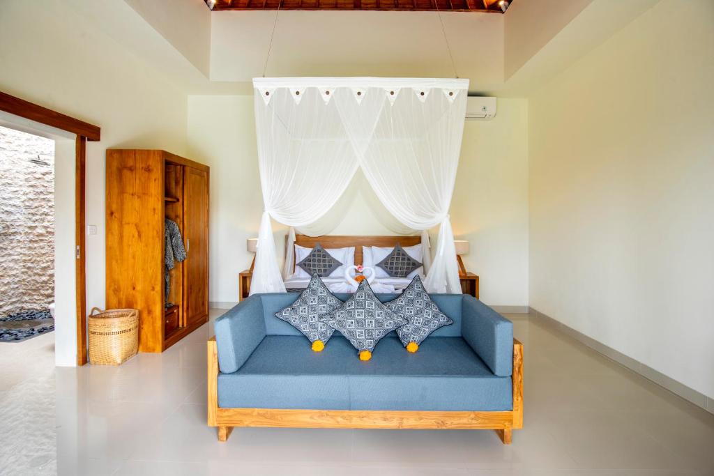 Letto o letti in una camera di Jatining Ubud Villa & Spa
