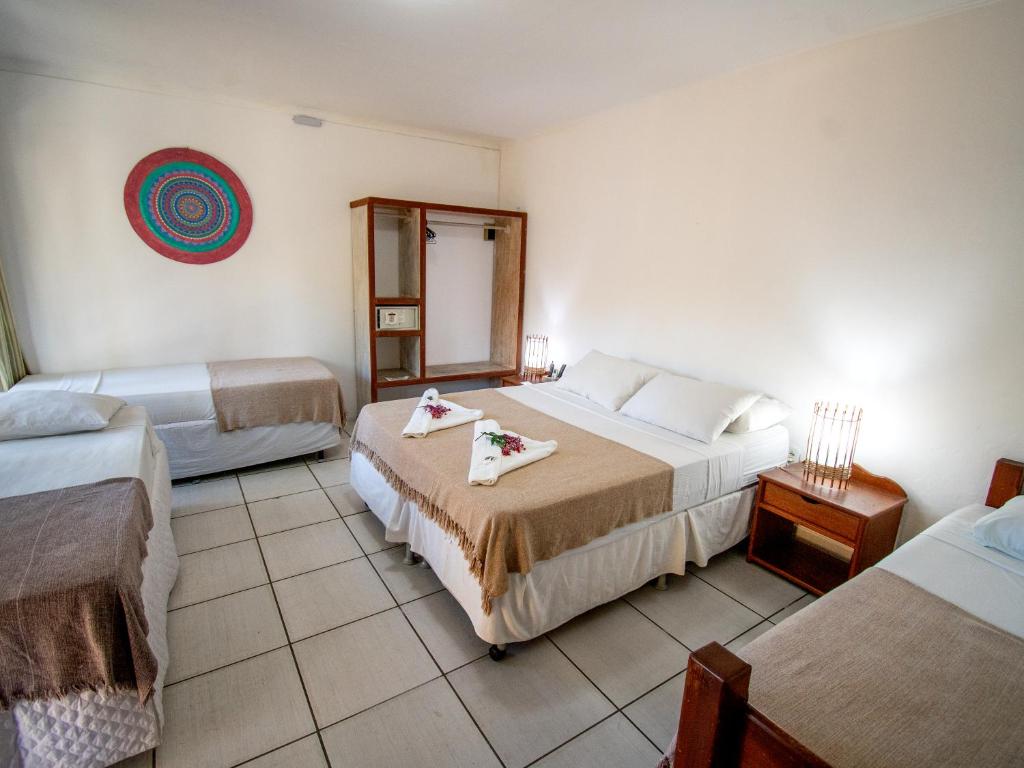 Postel nebo postele na pokoji v ubytování Pousada Arraial Candeia