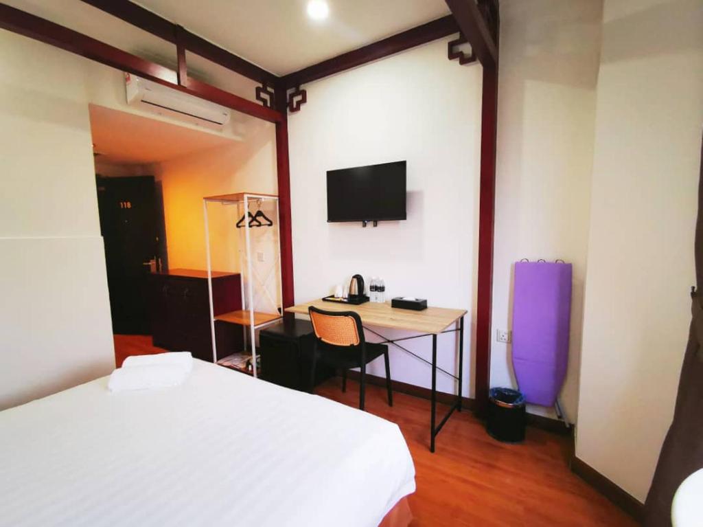 Postel nebo postele na pokoji v ubytování Regalodge Hotel & Spa Ipoh