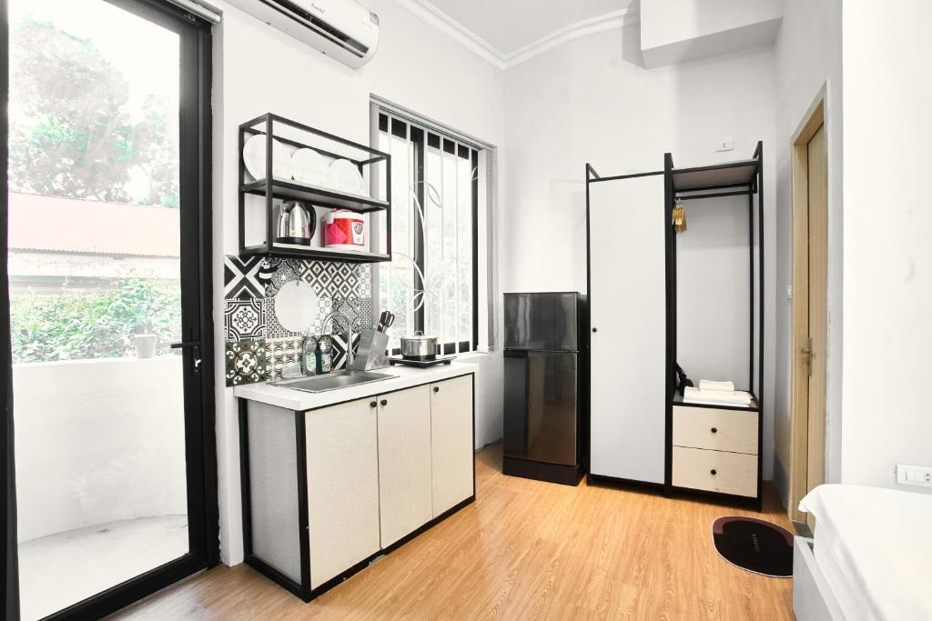 Kuchyň nebo kuchyňský kout v ubytování Eco Nest Hotel & Apartment