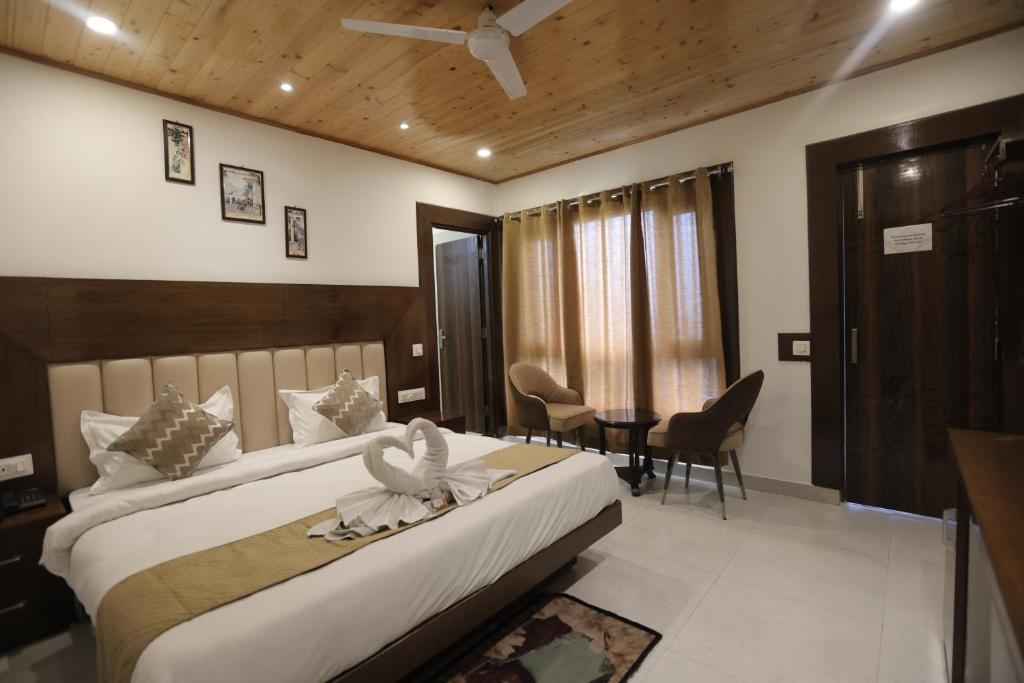 Postel nebo postele na pokoji v ubytování StudioZ Paradise Hills Mussoorie