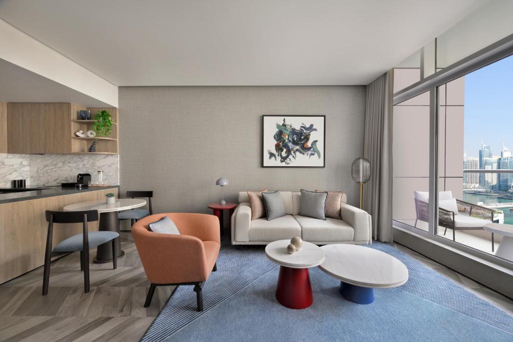 a living room with a couch and a table at InterContinental Dubai Marina by IHG in Dubai