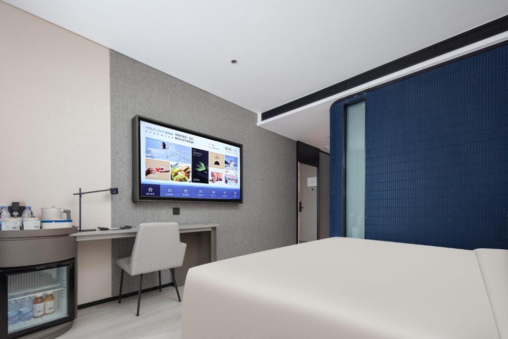 TV a/nebo společenská místnost v ubytování Atour Light Hotel Dongguan Songshan Lake University Town