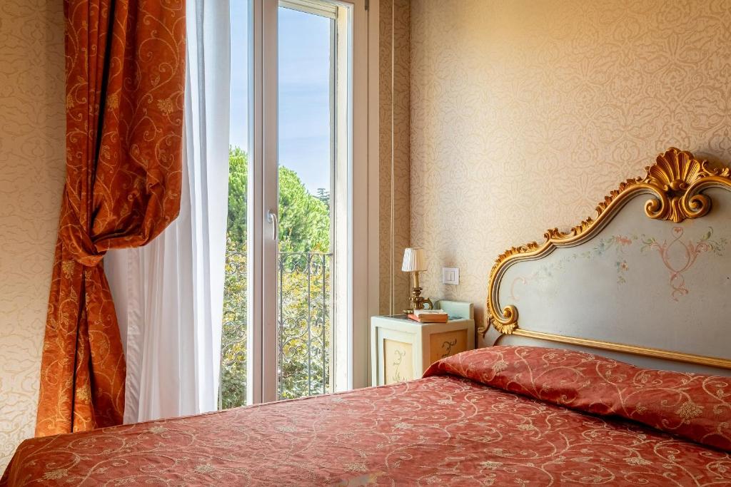 Postel nebo postele na pokoji v ubytování Hotel Rigel