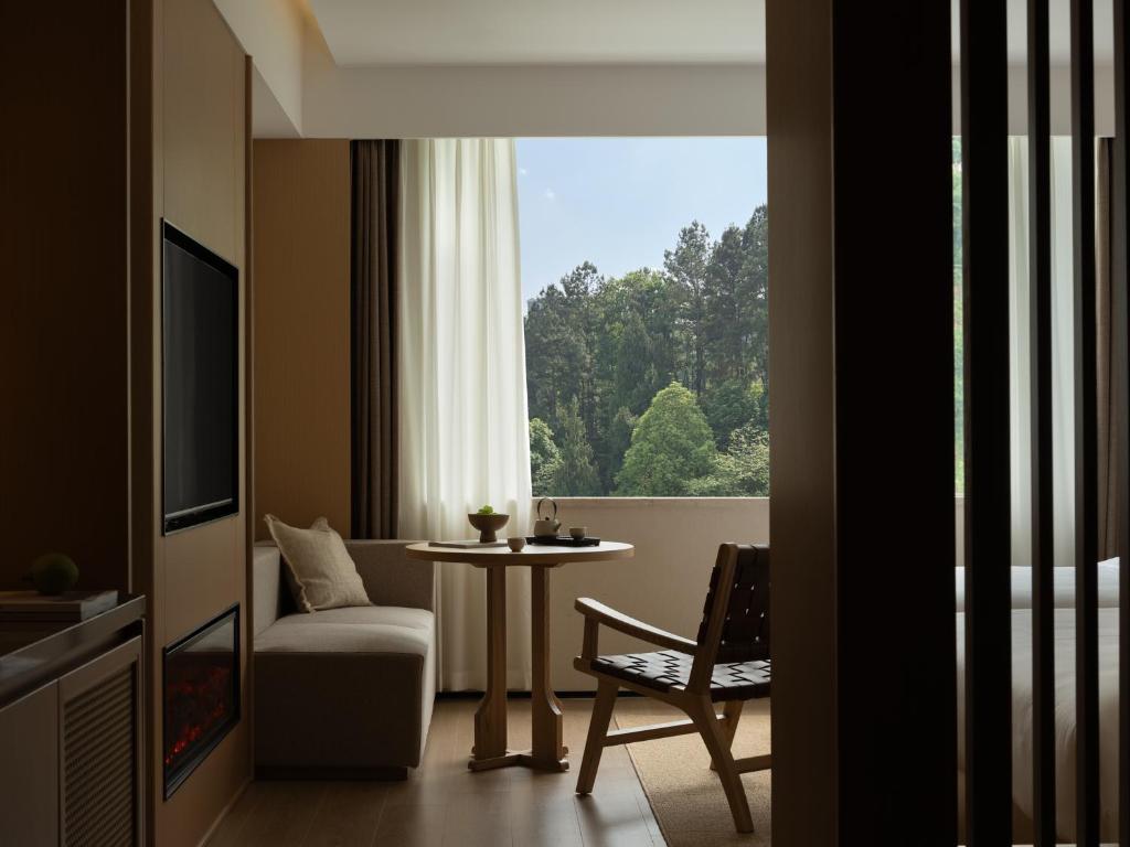 TV a/nebo společenská místnost v ubytování Yanyu Yunxi Resort Hotel 烟雨云兮酒店