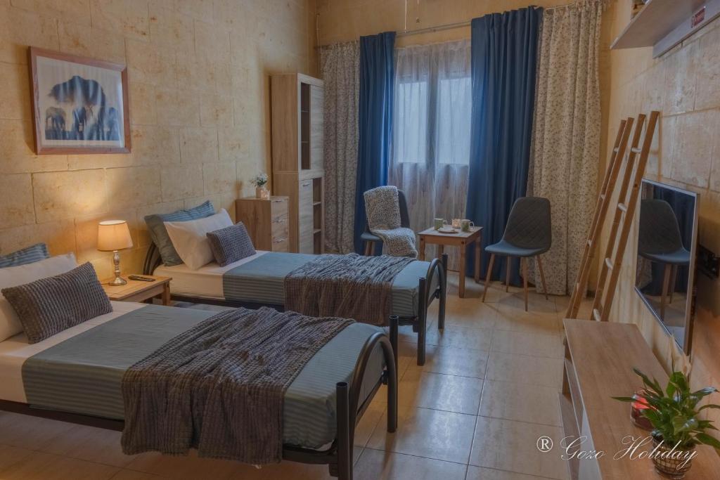 Letto o letti in una camera di Hollies