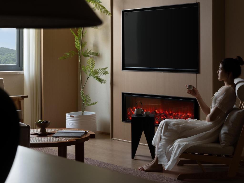 TV a/nebo společenská místnost v ubytování Yanyu Yunxi Resort Hotel 烟雨云兮酒店