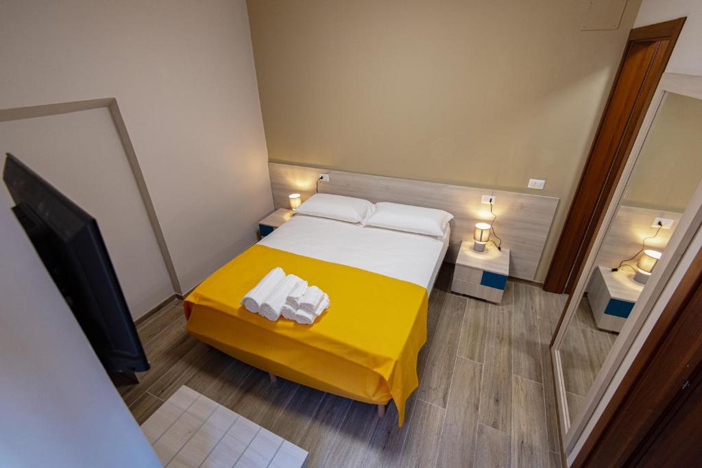 Postel nebo postele na pokoji v ubytování Nella mia città