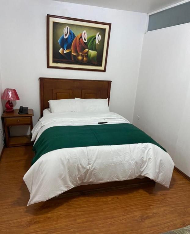 Postel nebo postele na pokoji v ubytování Loreto hotel