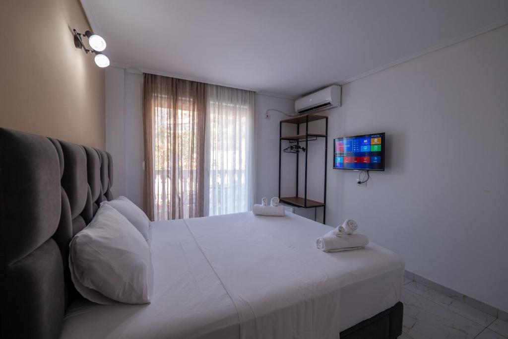 Postel nebo postele na pokoji v ubytování Hotel Elite Sarande