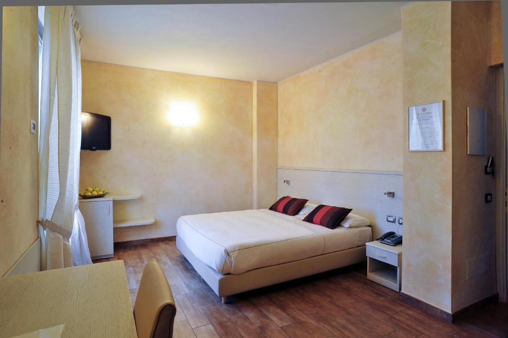 Postel nebo postele na pokoji v ubytování Agriturismo La Camilla