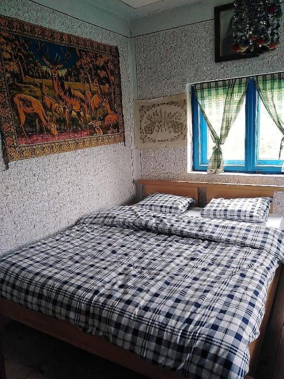 Postel nebo postele na pokoji v ubytování Etno kuća Krvavac