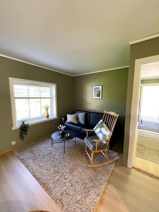 a living room with a couch and a table at Flat in the center of Loen in Loen