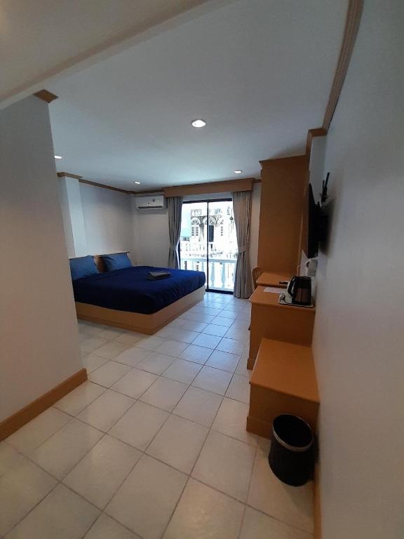 Postel nebo postele na pokoji v ubytování JB House Patong