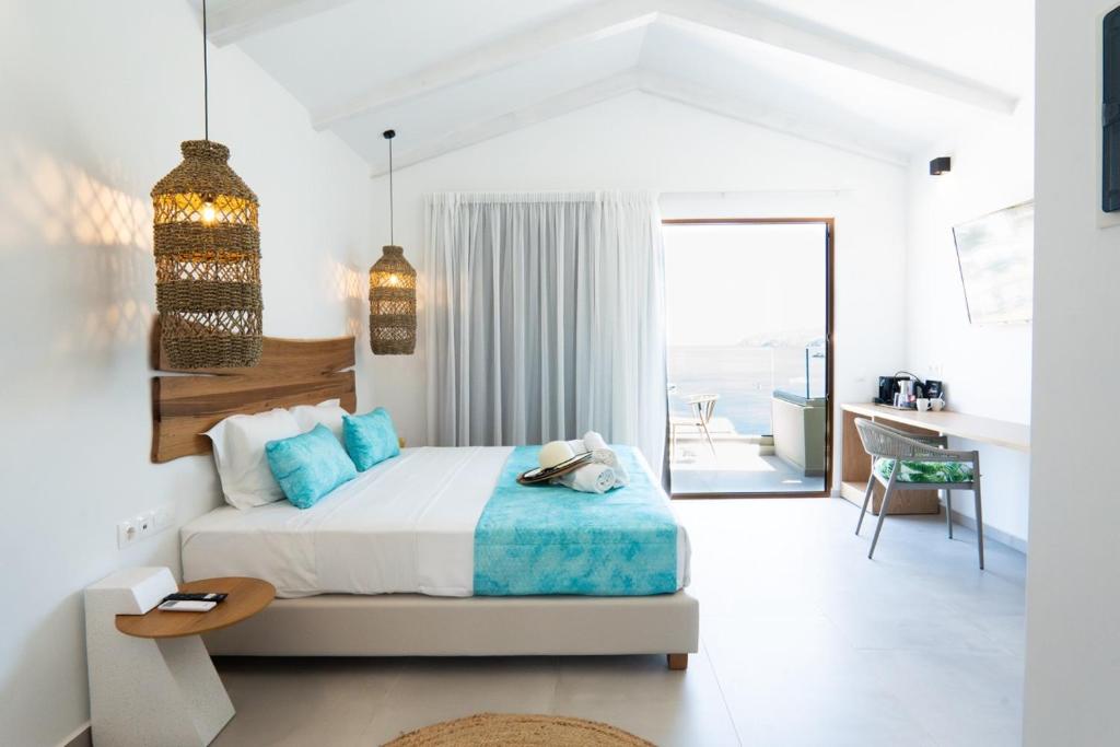 Postel nebo postele na pokoji v ubytování Zoe Boutique Hotel