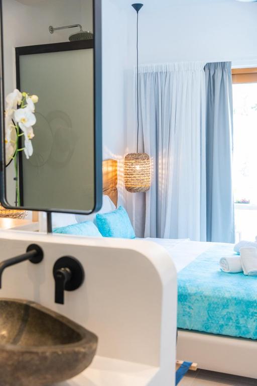 Postel nebo postele na pokoji v ubytování Zoe Boutique Hotel