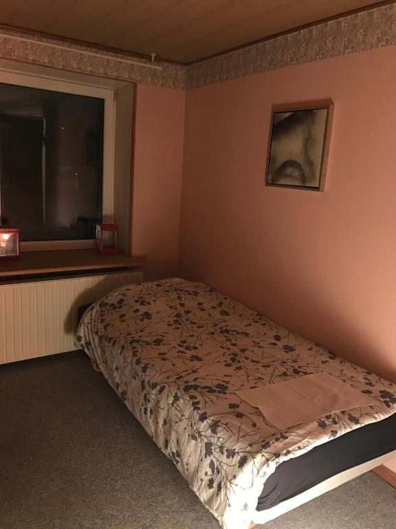 Postel nebo postele na pokoji v ubytování Rundvejen Guest House