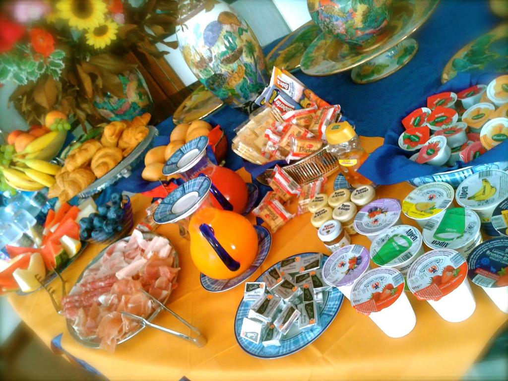 a table with a bunch of food on it at B&B Cà d'Artisti in Caorle