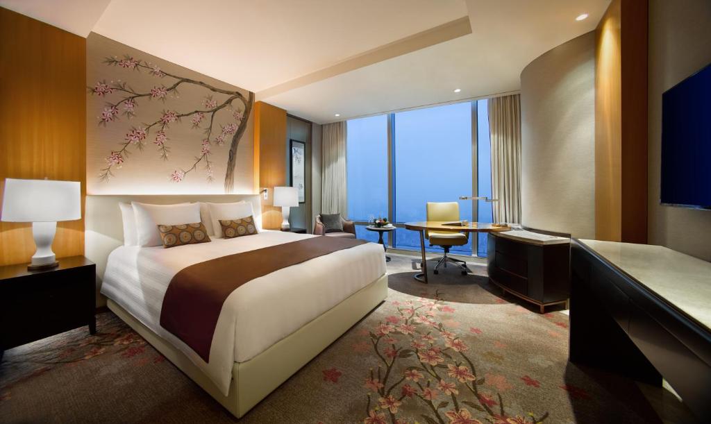 Postel nebo postele na pokoji v ubytování Lotte Hotel Hanoi