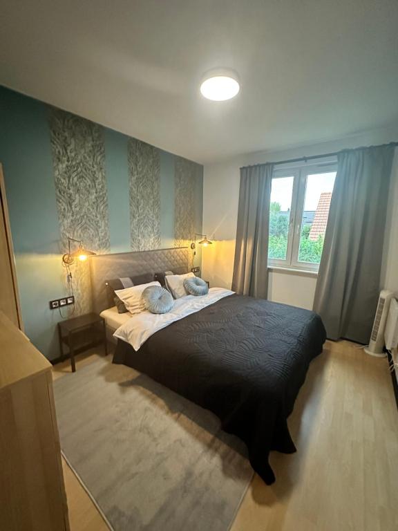 Posteľ alebo postele v izbe v ubytovaní Dekoratoria Apartments