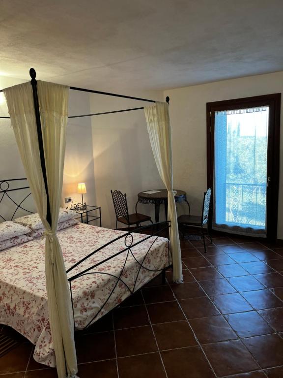 Postel nebo postele na pokoji v ubytování Agriturismo Podere Forano