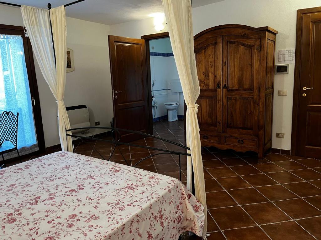 Postel nebo postele na pokoji v ubytování Agriturismo Podere Forano