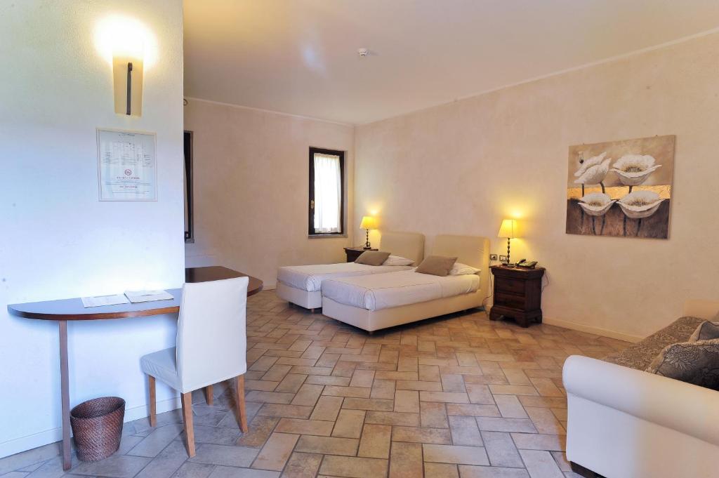 Postel nebo postele na pokoji v ubytování Agriturismo La Camilla