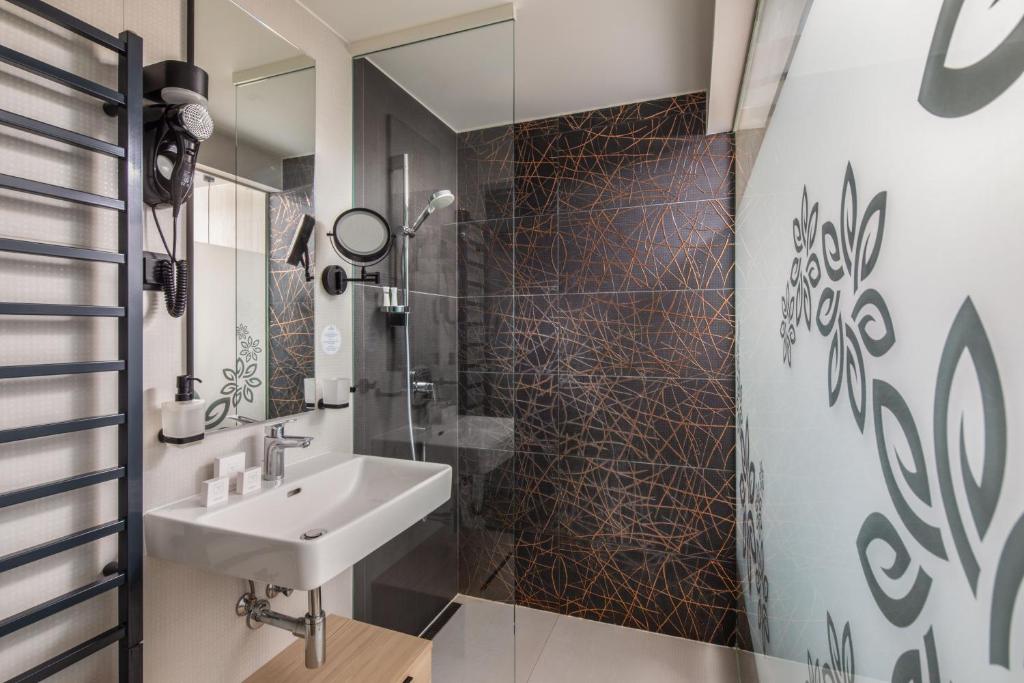 Koupelna v ubytování Sungarden Wellness Hotel Siófok