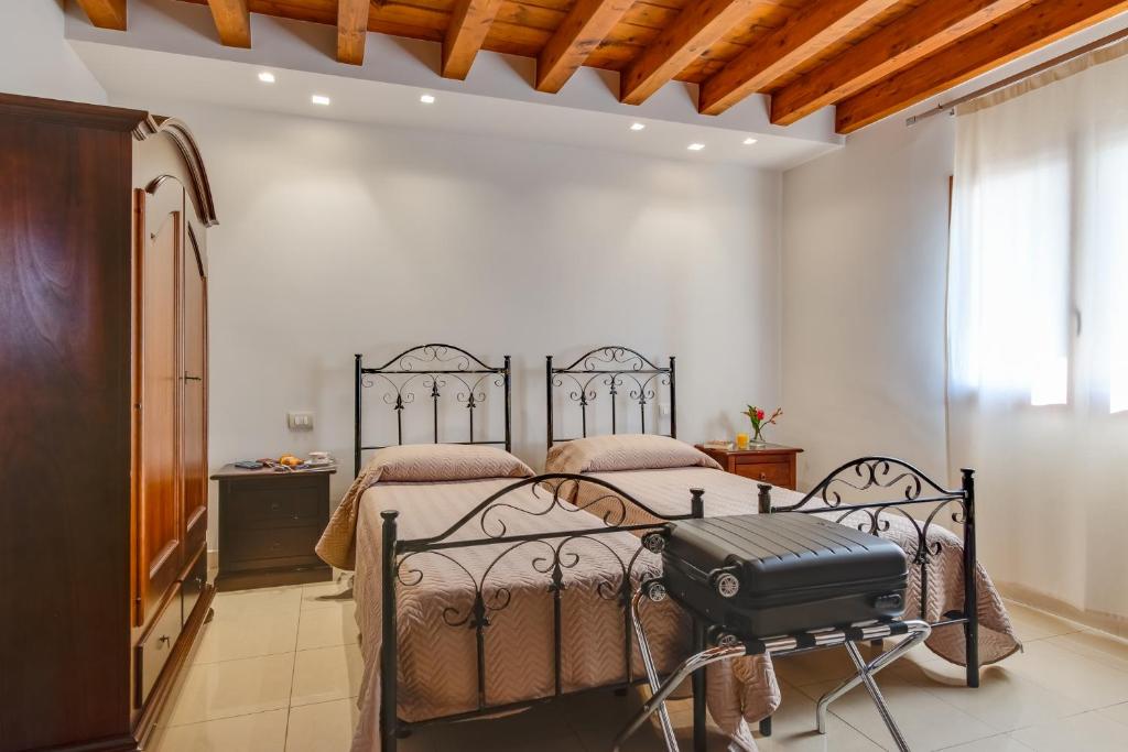 Postel nebo postele na pokoji v ubytování Hotel Aliai