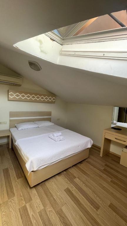 Postel nebo postele na pokoji v ubytování Agartha Suite Hotel Kemer