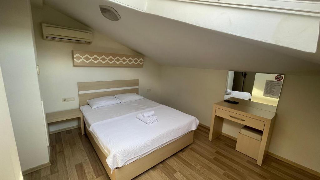 Postel nebo postele na pokoji v ubytování Agartha Suite Hotel Kemer