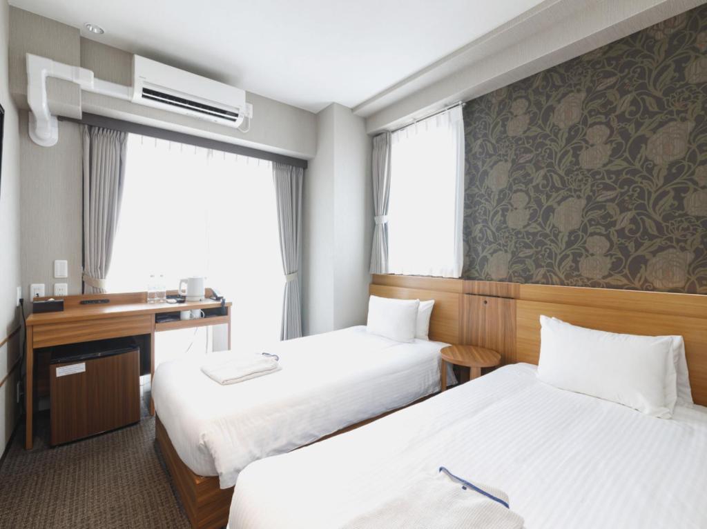 Postel nebo postele na pokoji v ubytování Five Hotel Osaka