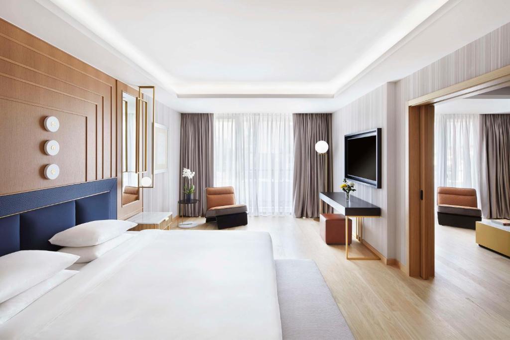 Ένα ή περισσότερα κρεβάτια σε δωμάτιο στο Grand Hyatt Athens