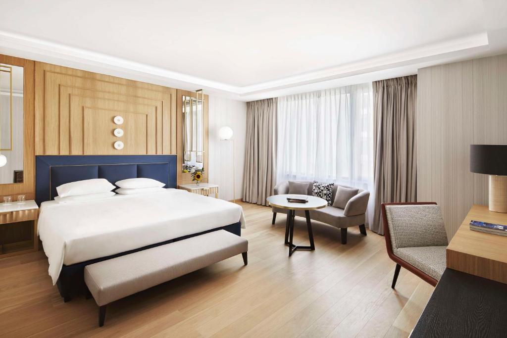 Ένα ή περισσότερα κρεβάτια σε δωμάτιο στο Grand Hyatt Athens