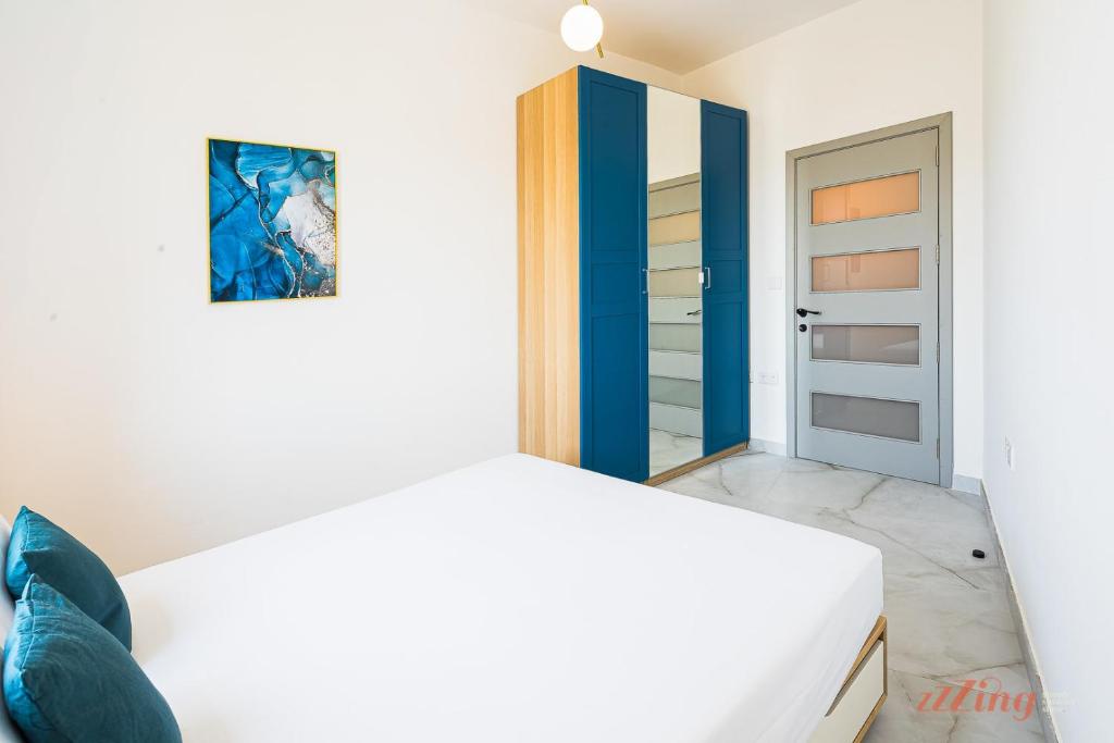 Postel nebo postele na pokoji v ubytování The Gozo Holiday Apartment that Feels like Home
